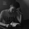 man sitting alone journal reflecting Masonic education