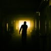 man walking empty hallway Masonic education