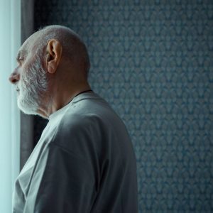 man alone reflecting window Masonic education