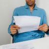 man reading letter at desk Masonic education