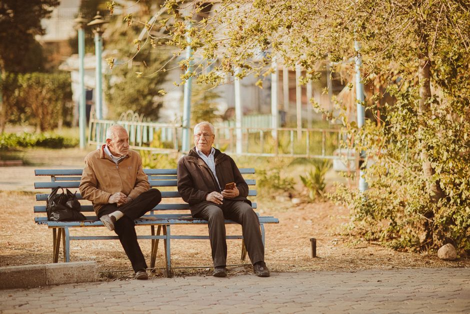 two men talking park bench Masonic education