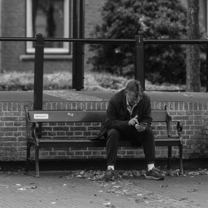 man sitting alone park bench Masonic education