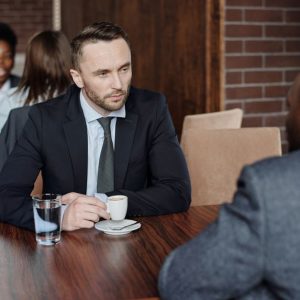 two men talking office table Masonic education