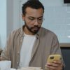man sitting quietly phone table Masonic education