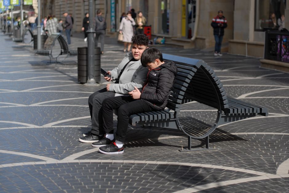older man younger man talking bench Masonic education